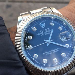 Black and silver analog watch with link bracelet